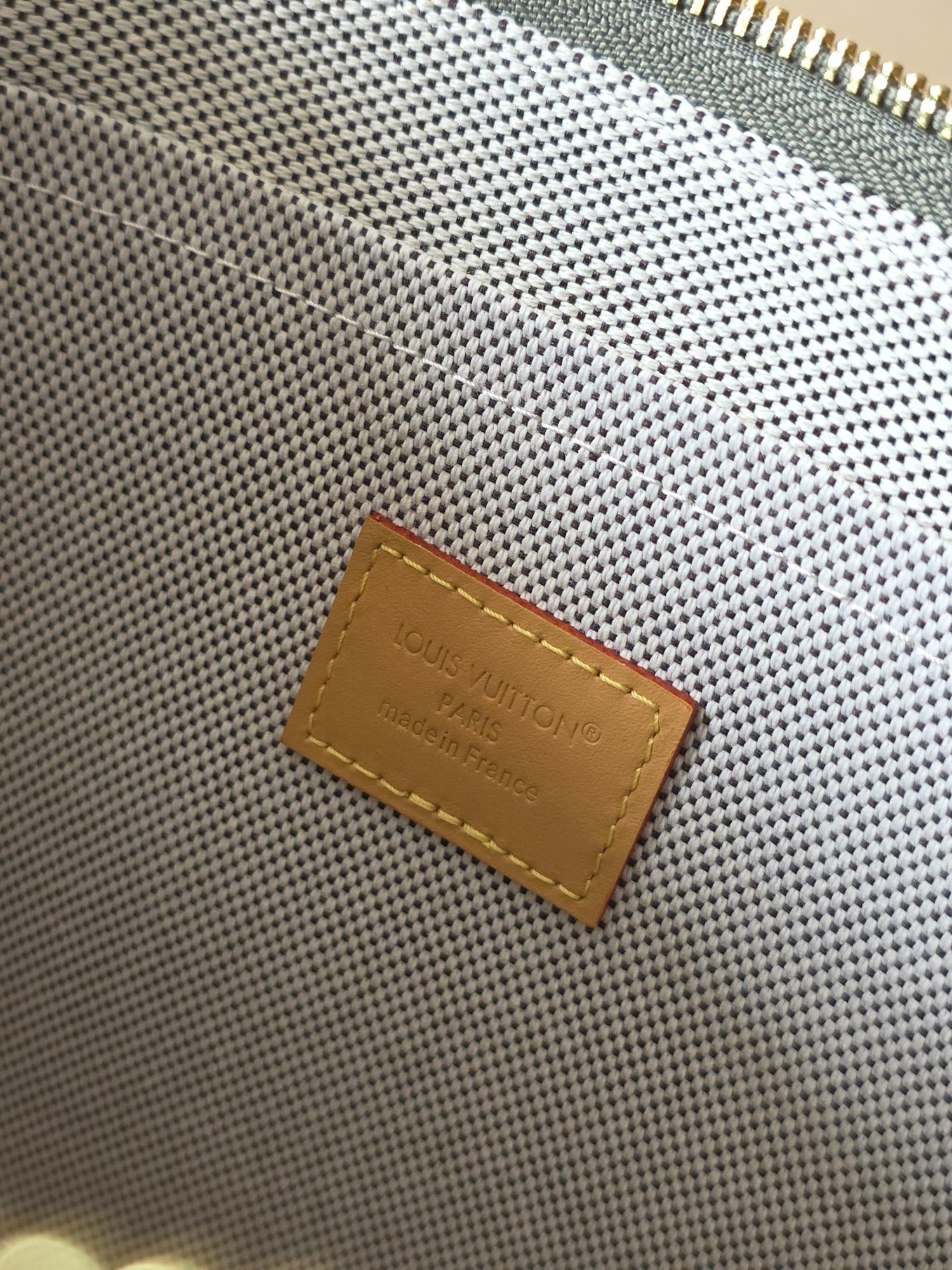 LV Voyage medium clutch Camouflage Green Monogram Canvas 274822